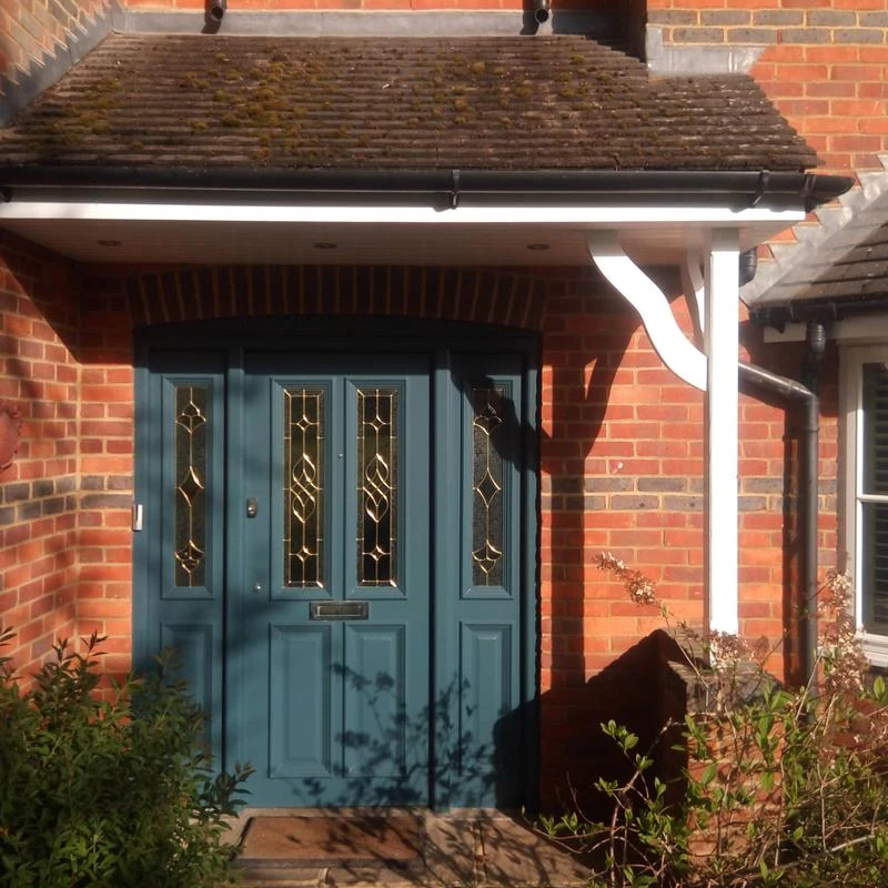 Teal front door and white porch trim by PA Painting & Decorating — Ascot Decorators